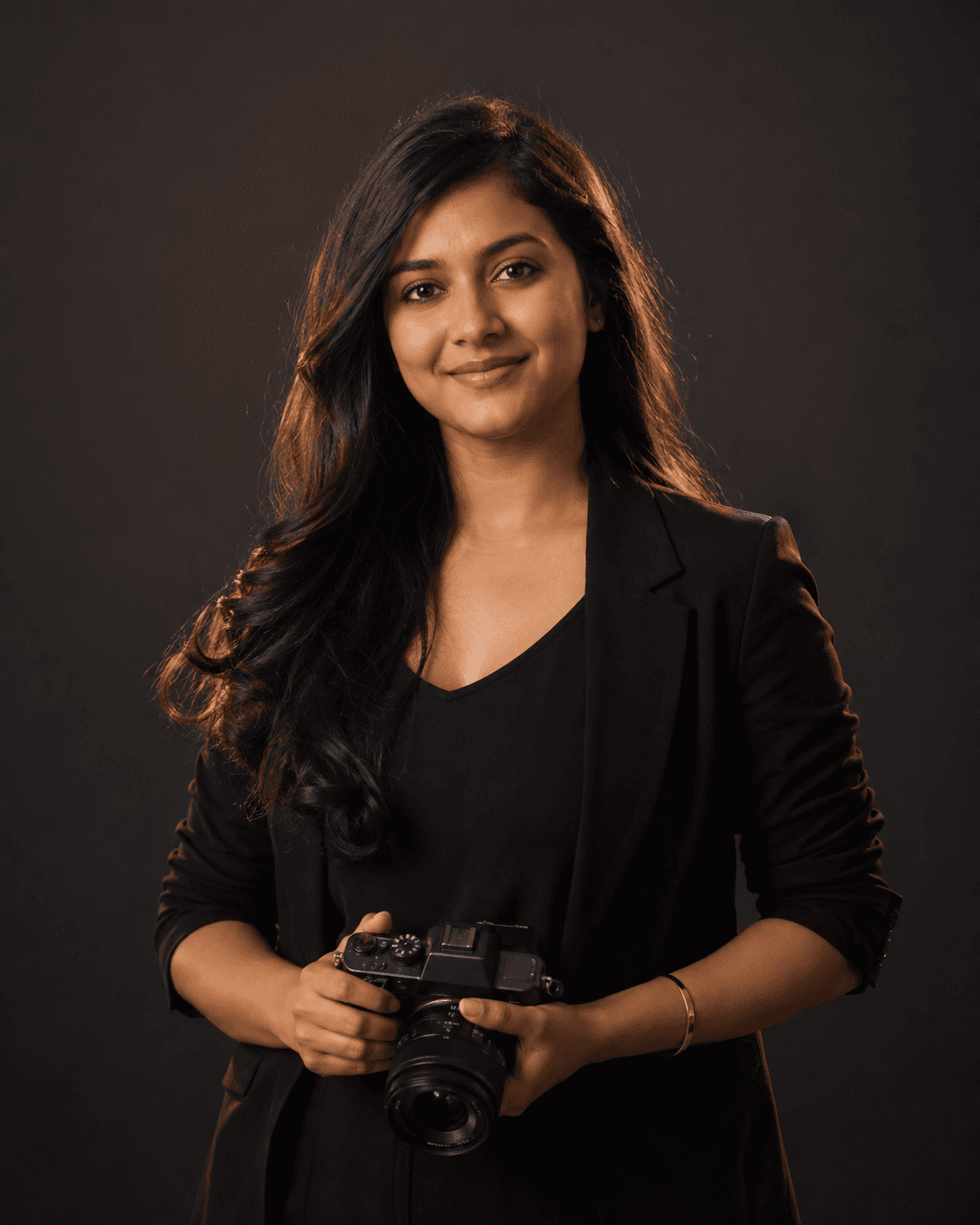 Portrait of team member 02 holding a camera